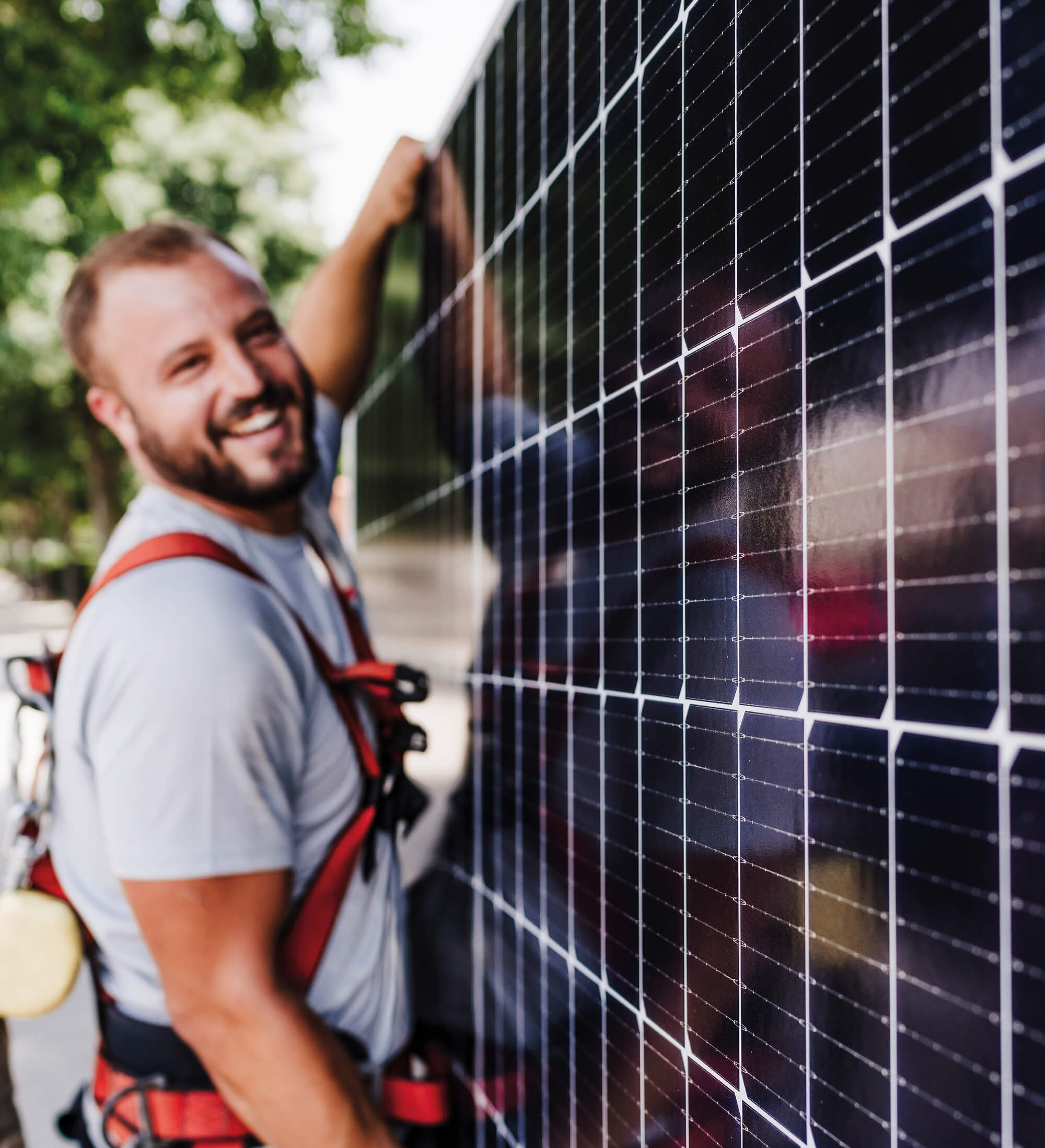 Solar installer working with photovoltaic panels